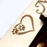 close up engraved paw heart